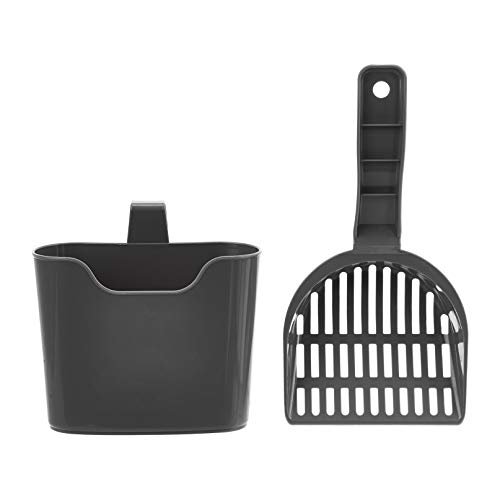 Amazon Basics plastic litter scoop hanging from a litter box rim
